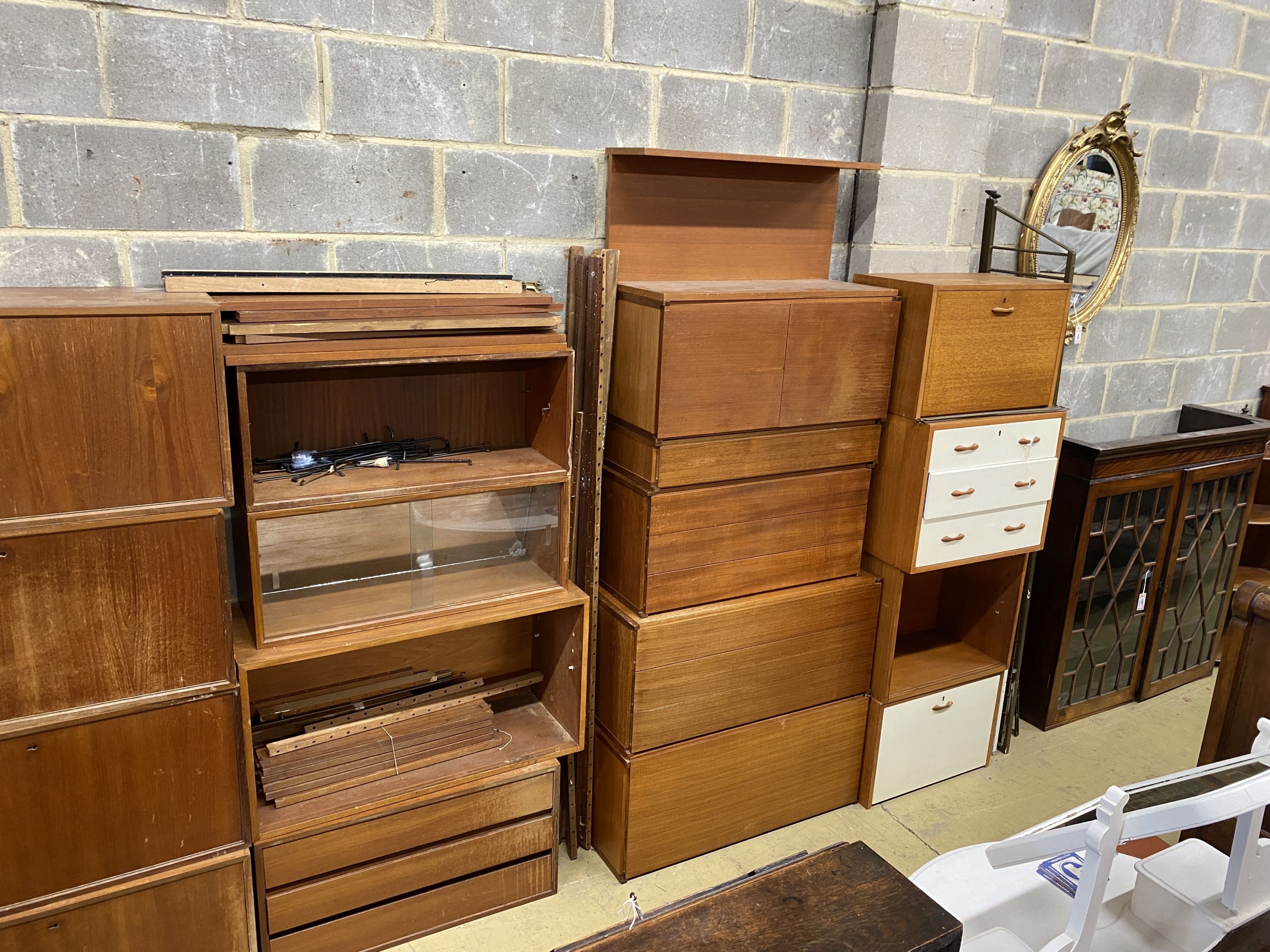 Three mid century teak modular wall systems by Poul Cadovious, Tapley and Staples ladder backs